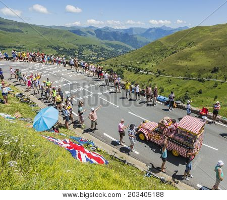 Col de PeyresourdeFrance- July 23 2014: Cochonou vehicle passing in the Publicity Caravn on the road to Col de Peyresourde in Pyrenees Mountains during the stage 17 of Le Tour de France 2014.