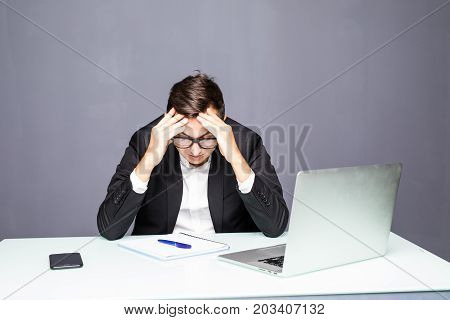Tired Businessman Working With Laptop In The Office