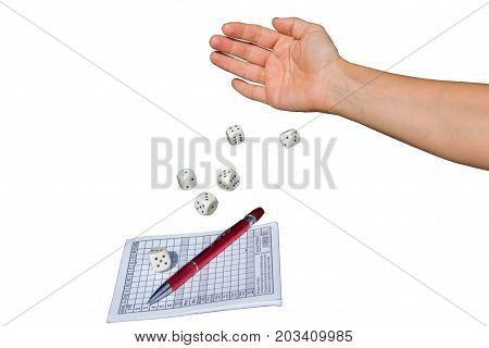 A woman's hand throws dice and plays a Yahtzee dice game