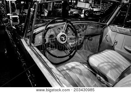 MAASTRICHT NETHERLANDS - JANUARY 08 2015: Cabin of a British sports car Alvis Three Litre TD21 DHC - Series I 1961. Black and white. International Exhibition InterClassics & Topmobiel 2015