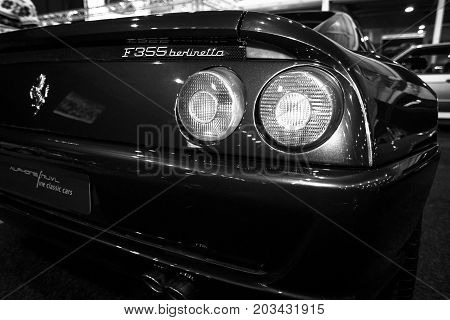 MAASTRICHT NETHERLANDS - JANUARY 08 2015: Stop lights of a sports car Ferrari F355 Berlinetta. Black and white. International Exhibition InterClassics & Topmobiel 2015