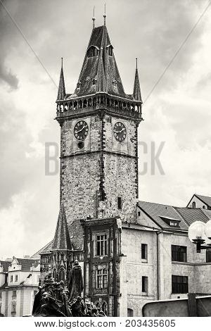 Old town hall with Jan Hus memorial in Prague Czech republic. Architectural scene. Travel destination. Black and white photo.