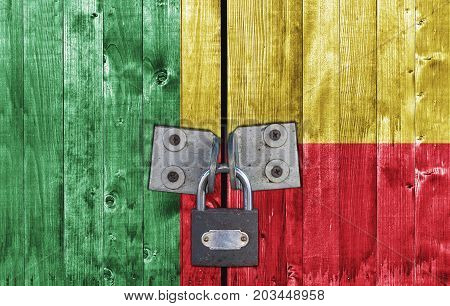Benin flag on door with padlock close