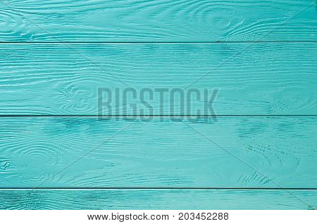 background of wooden boards painted light blue and turquoise