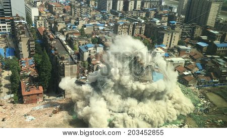 Downtown building demolition by controlled implosion in China
