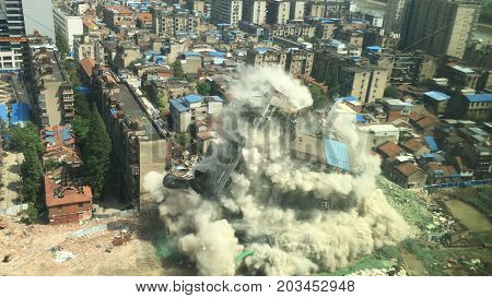 Downtown building demolition by controlled implosion in China