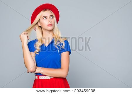 Portrait Of A Stunning Fashionable Lady In Bright Red Dress Posing Over Gray Background. Colors Of S