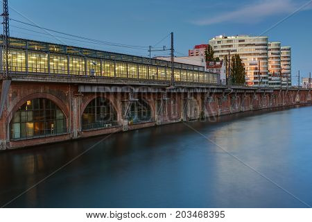 Trainstation at the river Spree in Berlin at dusk