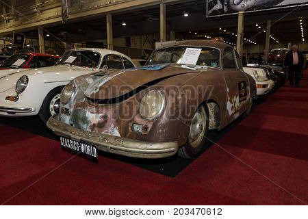 MAASTRICHT NETHERLANDS - JANUARY 09 2015: Rusty body Porsche 356 pre A coupe Continental 1955. International Exhibition InterClassics & Topmobiel 2015
