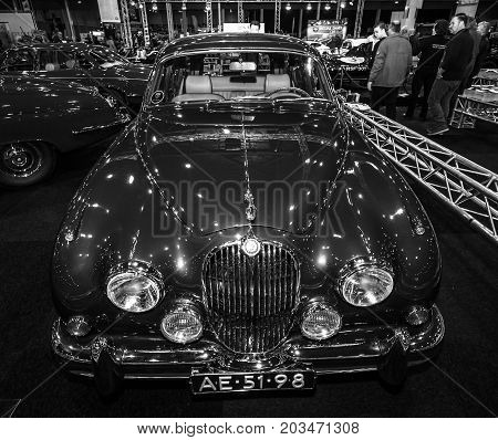 MAASTRICHT NETHERLANDS - JANUARY 09 2015: A sports saloon Jaguar Mk 2 County Prototype 1962. Black and white. International Exhibition InterClassics & Topmobiel 2015
