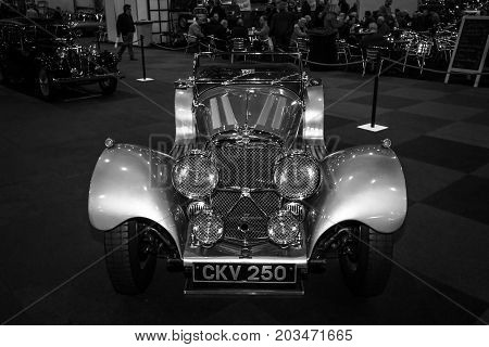MAASTRICHT NETHERLANDS - JANUARY 09 2015: A sports car Jaguar SS100 3.5 1937. Black and white. International Exhibition InterClassics & Topmobiel 2015