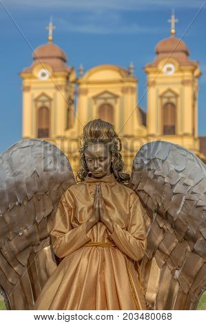 TIMISOARA ROMANIA - SEPTEMBER 8 2017: Living statue of a woman dressed with angel elements and present on the street inside the CheckART Carnival organized by the City Hall Timisoara. Union Square.