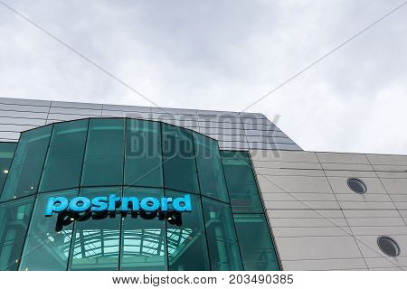 Postnord blue building and sign at Amager Copenhagen Denmark September 8 2017