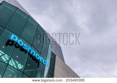 Blue sign on a glass facade at Amager Copenhagen Denmark September 8 2017