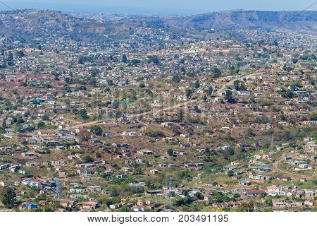 Birds Eye Overlooking rural community home houses in Marianhill highway landscape.