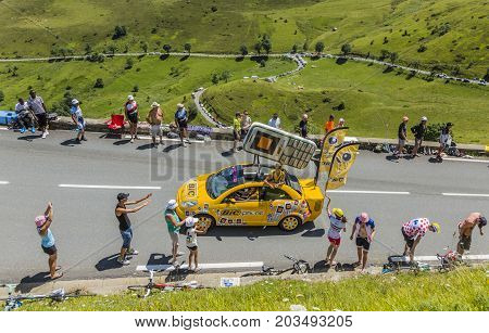 Col de PeyresourdeFrance- July 23 2014: BIC vehicle passing in the Publicity Caravn on the road to Col de Peyresourde in Pyrenees Mountains during the stage 17 of Le Tour de France 2014.