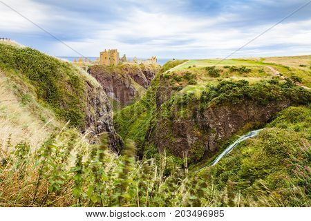 Scotland - August 2014: dunnottar castle at sunset scotland united kingdom It is located on a peninsula overlooking the North Sea