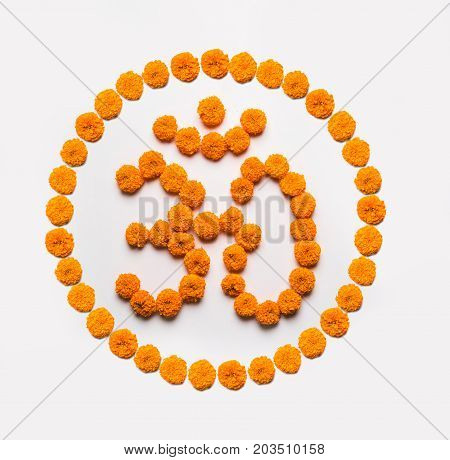 Stock photo of word Aum or om made using marigold flower arrangement