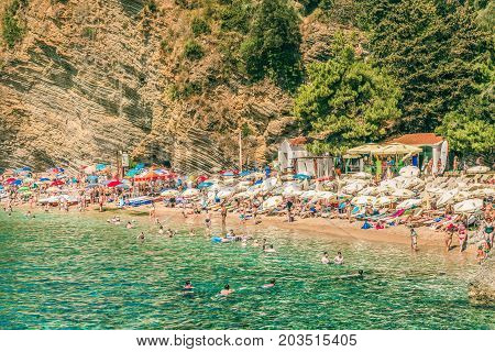 Budva, Montenegro - August 18, 2017: View of Mogren beach in Budva, Montenegro. Mogren is one of the most popular beaches on the Budva Riviera