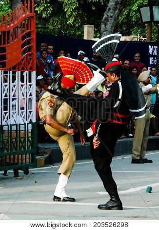 The marching Pakistani and Indian guards in national uniform at the ceremony of lowering the flags - 04-05-2015 border between Pakistan and India Wagah Lahore Pakistan