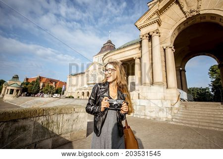 Portrait of a young woman tourist on the Haken terrace traveling in Szczecin city in Poland