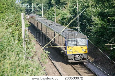 Alresford Essex United Kingdom -12 August 2017: UK train Carriage Electric four piece unit on Track in woods