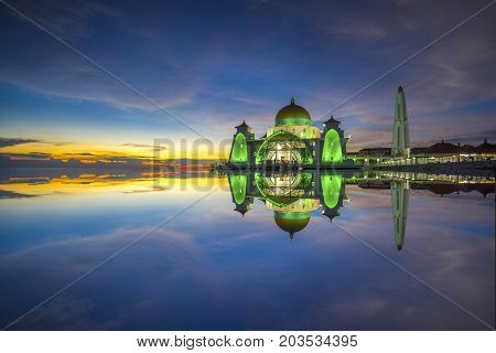 Strait mosque during beautiful blue hour .