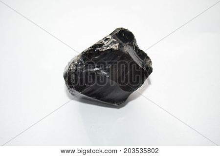 Obsidian , Raw obsidian on a white background