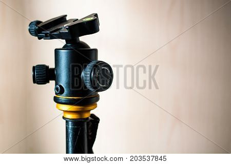 Head of black tripod camera. Adjustable platform.
