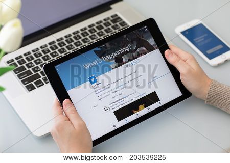 Alushta Russia - May 26 2017: Man holding iPad Pro on the table with social networking service Twitter on the screen. iPad Pro was created and developed by the Apple inc.