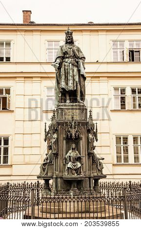 Old statue of Charles IV Prague Czech republic. Architectural theme. Yellow photo filter.