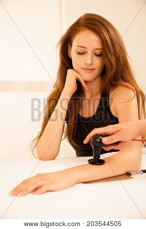 Physiotherapist Doing Tecar Therapy Alterantive Treatment On A Woman Patient
