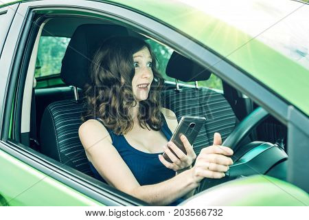 Driver Woman With A Phone In Hands Makes An Accident. Fright, Inconsiderate And Dangerous Driving. T