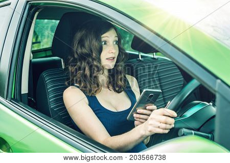Driver Woman With A Phone In Hands Makes An Accident. Fright, Inconsiderate And Dangerous Driving. T