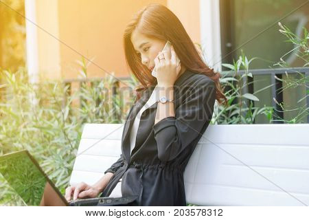 Businessmen And Women Are Using Mobile And Touch Smart Phone For Communication And Checking On Busin