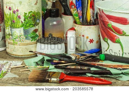 BRNO CZECH REPUBLIC -10 September 2017: Products made by decoupage technique. Decoupage is a technique of decorating items napkins. Workshop of the painter. Work desk mess