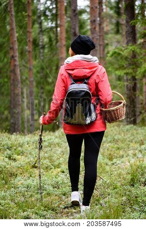 Young Woman In Red Jacket Enjoying Nature In Forest. Latvia