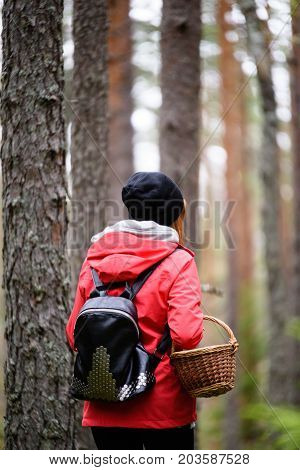 Young Woman In Red Jacket Enjoying Nature In Forest. Latvia