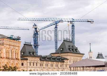 Crains on construction site of building. Construction background