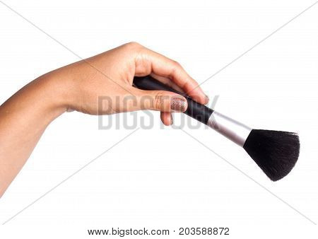 Women's hand with cosmetic accessories - powderbrush