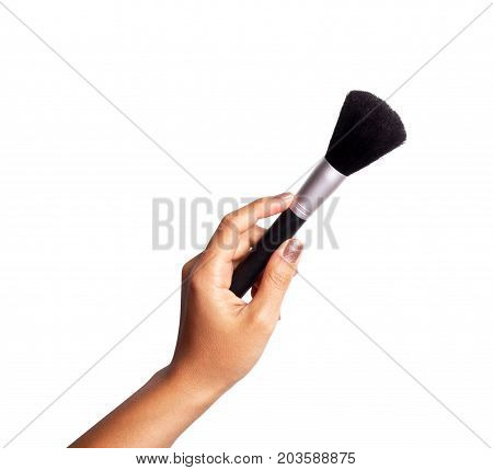 Women's hand with cosmetic accessories - powderbrush