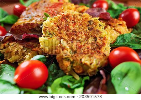 Homemade Veg Burgers From Potatoes And Lentils, Served On A Plate With Tomatoes And Green Salad On A