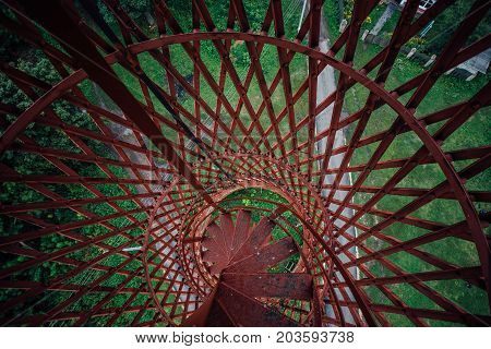 Top view of spiral staircase of rusty abandoned water tower. First hyperboloid of engineer Shukhovl in Lipetsk Region