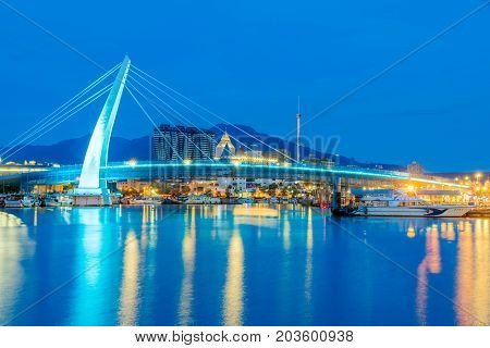 AIPEI TAIWAN - JULY 05: This is a night view of Lover's bridge a famous bridge in the Fisherman's wharf are of Tamsui where people come to see the sunset on July 05 2017 in TaipeiT