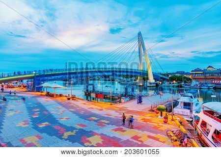 TAIPEI TAIWAN - JULY 05: This is an evening view of Tamsui fisherman's wharf and the famous lover's bridge where couples visit to view the sunset on July 05 2017 in Taipei