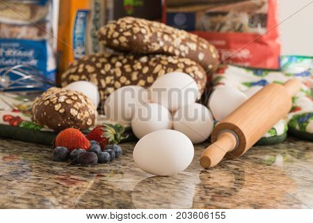 Eggs bread and ingredients prepare for cooking on marble table.