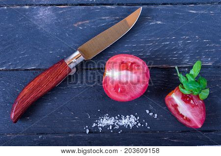 Cutting Tomatoes With A Penknife.