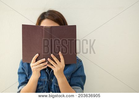 Asian Woman Reading A Book Vintage Style.