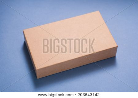 Box on blue background, close-up, mockup packaging
