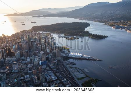 Beautiful Aerial View of Vancouver Downtown British Columbia Canada during a bright spring sunset.